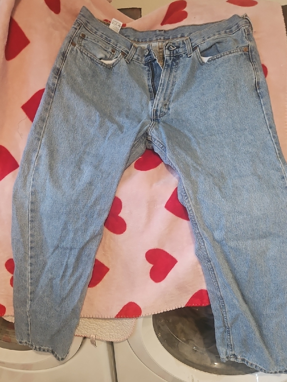 505 Men's Levi's light blue denim jeans with tan leather patch